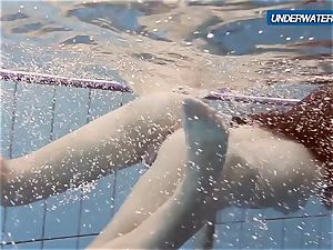 amateur Lastova resumes her swim
